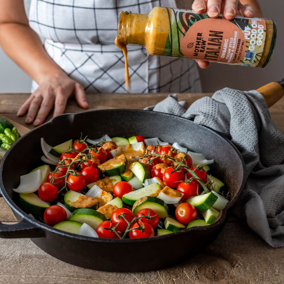 Organic Vegan Italian Dressing being poured on Greek Dish