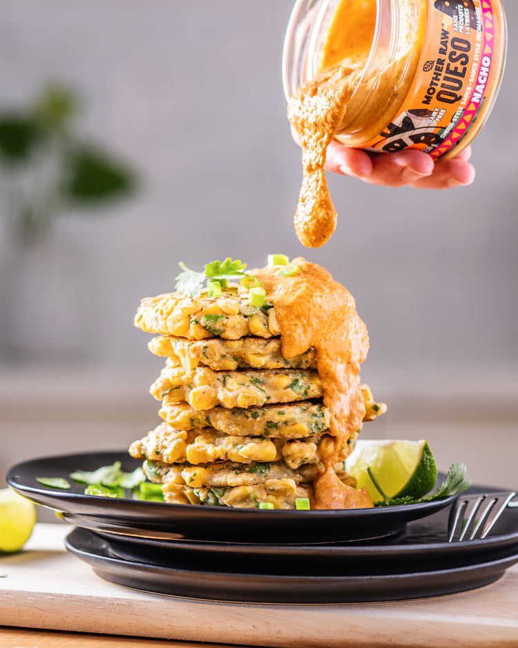 mother raw queso dip being poured on top of patties