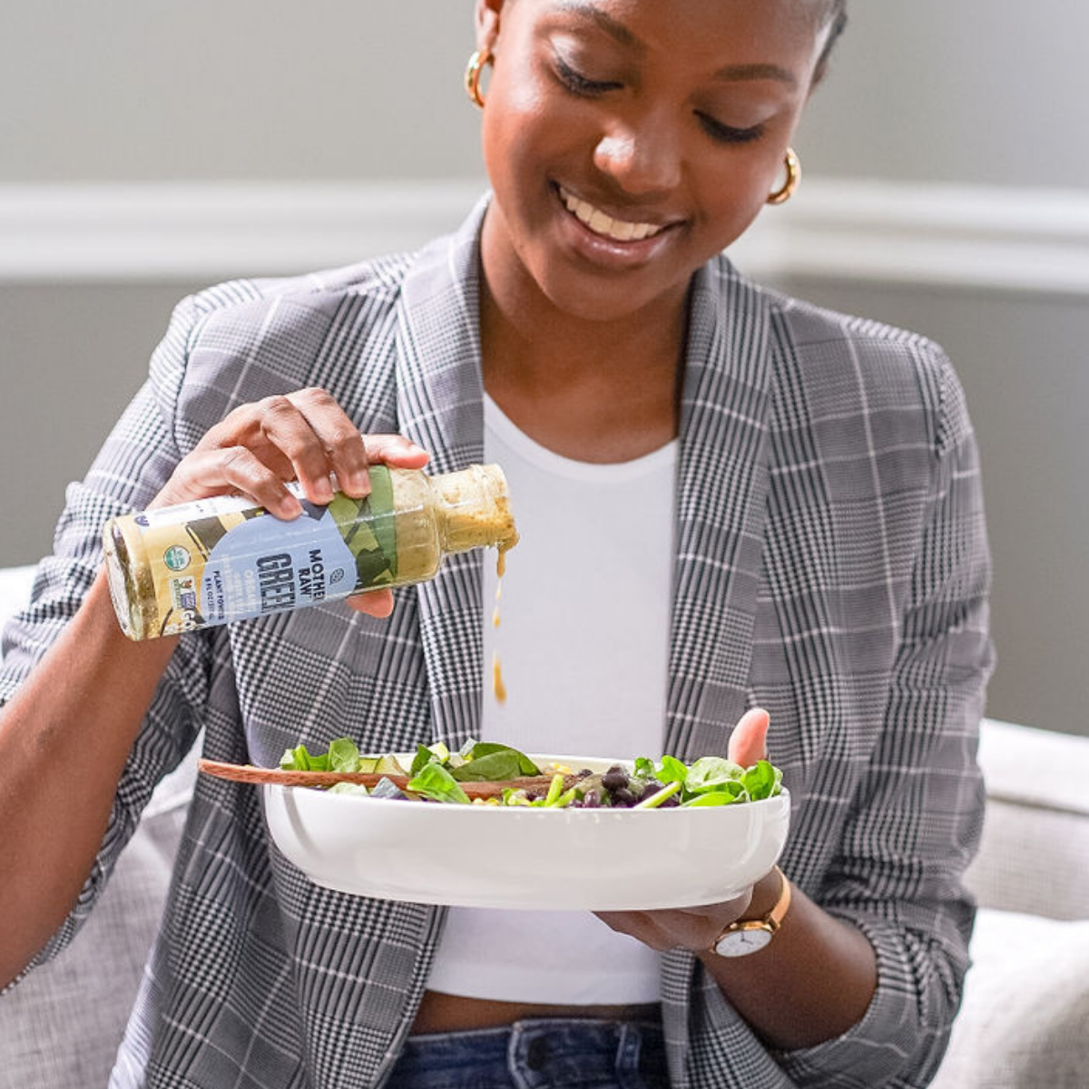 Women Dressing Salad with Vegan Greek Dressing